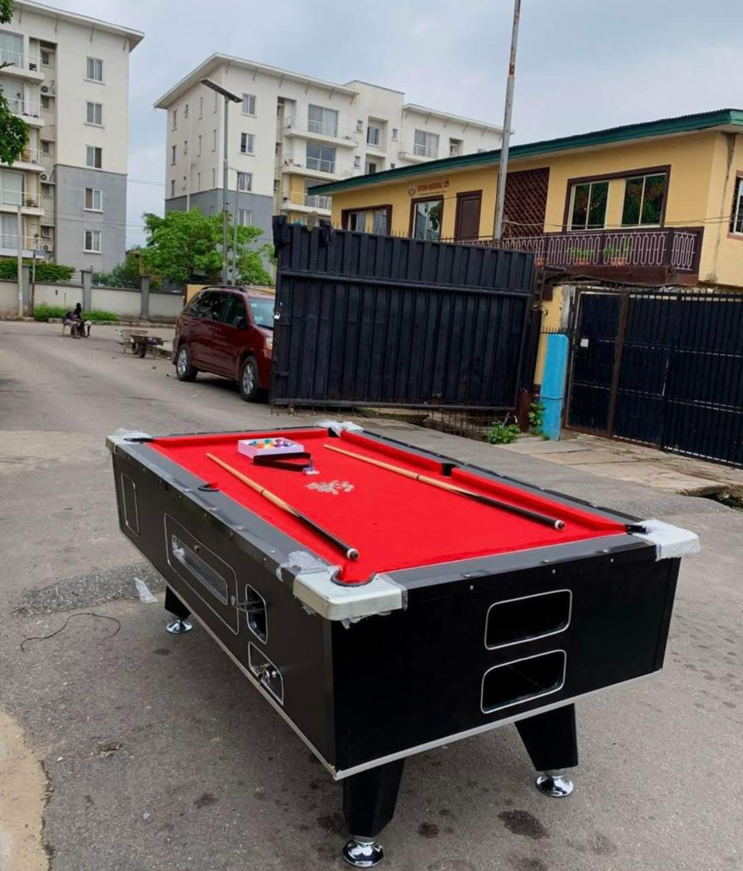 Black snooker table with red cloth